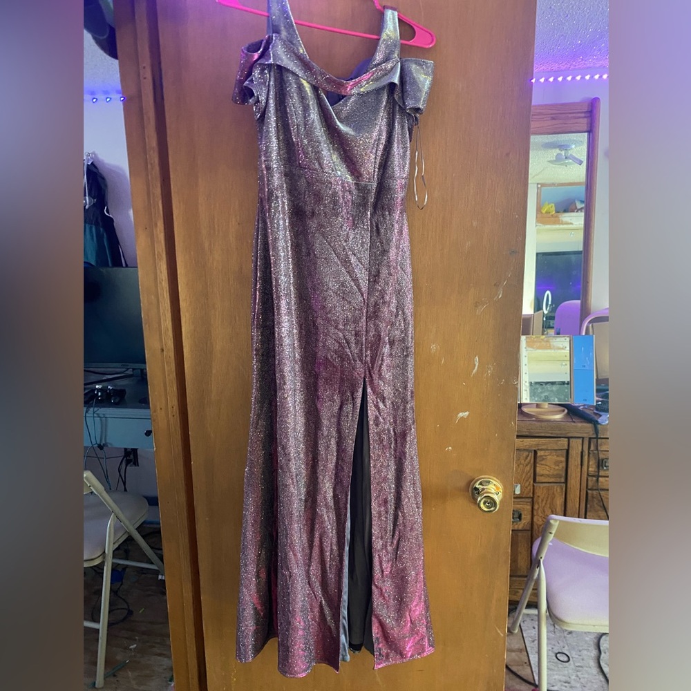 Worn once with a silver/purple color and a slit on the leg.